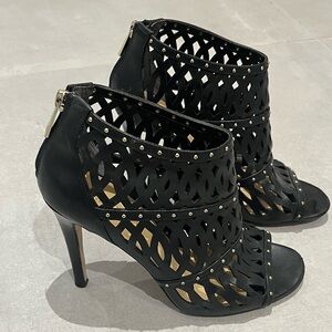 Black cage stiletto heels with gold stud accents. Ivanka Trump US 8.5